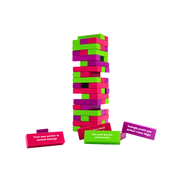 a colorful block stacking game with seductive or sexy writing on the blocks, one reads "treat your partner to a sensual massage"