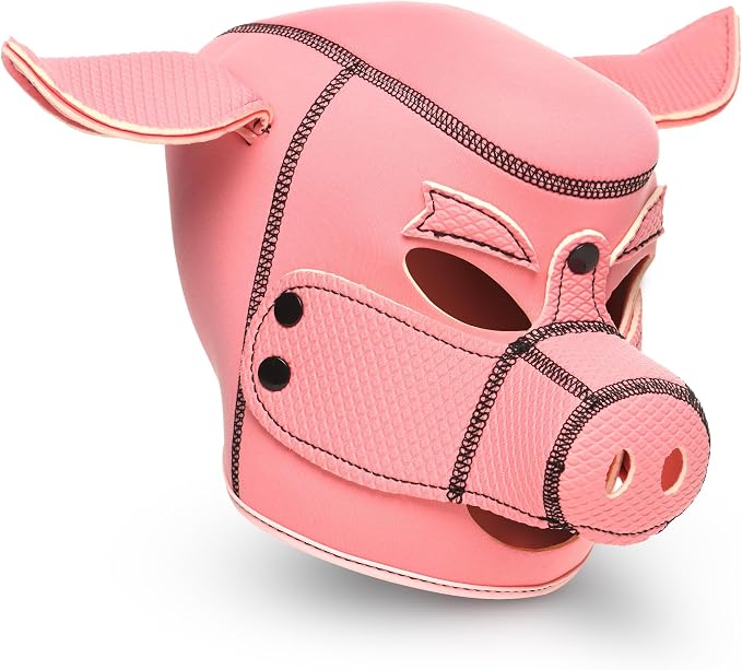 A pink faux-leather pig mask with textured panels, black contrast stitching, and small black eye studs, shown on a white background.